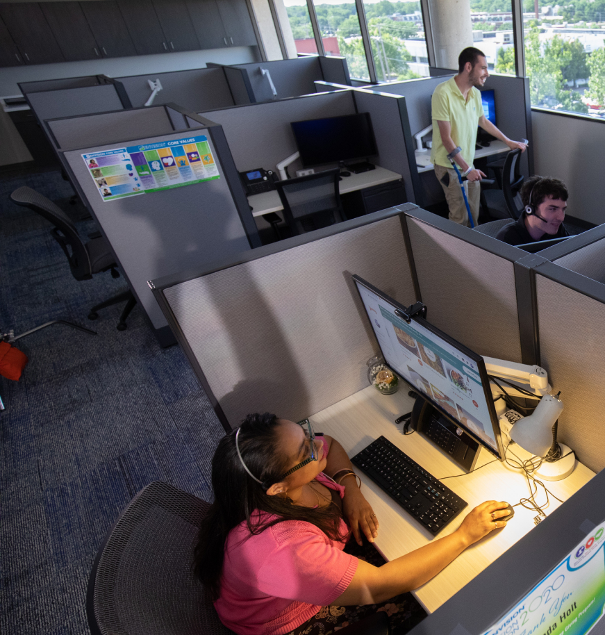 An aerial shot of WIC employees working at their cubicles.