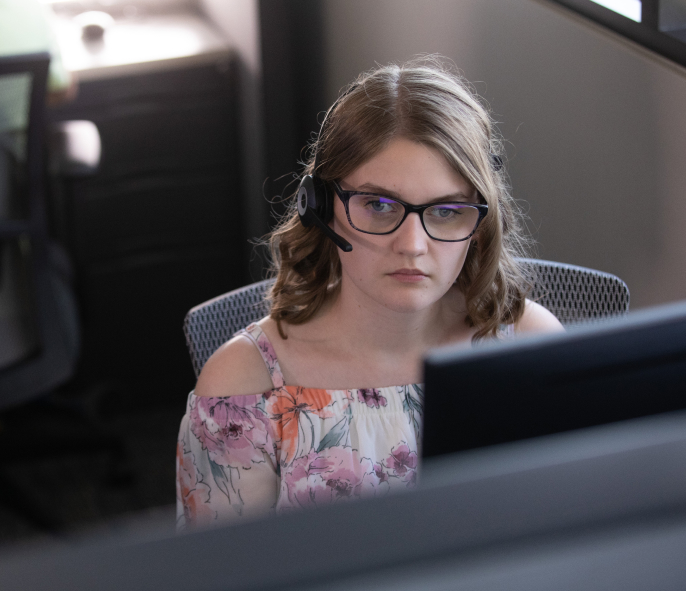 A young woman working on the computer.